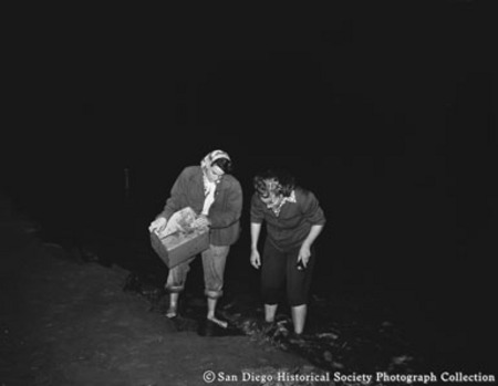 Two women hunting grunion on Silver Strand Beach