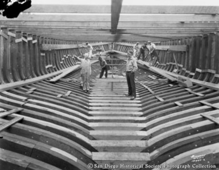Men working on boat frame at San Diego Marine Construction Company