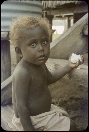 Young child with rice