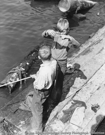 Two boys fishing on San Diego waterfront