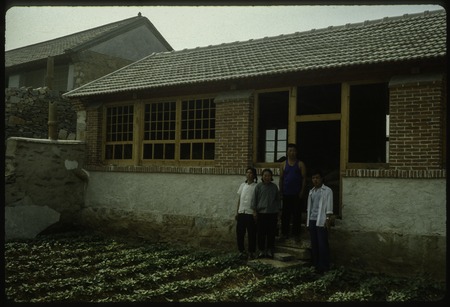 Group Photo in front of the Villagers&#39; House