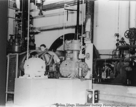 Man operating refrigeration machinery at American Agar Company kelp processing facility