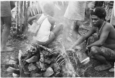 Cooking the sacrificial pig, &#39;Oloburi feast.