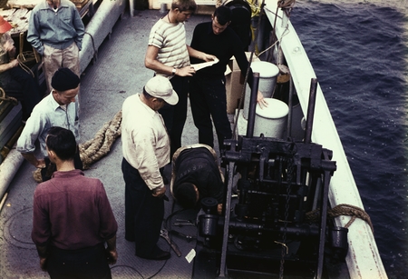 Men on deck of R/V HORIZON repair the clam bucket