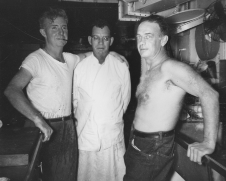 A pause in the lives of the galley crew. Left to right: Thomas J. O&#39;Callaghan, Frank Vaughn, head chef, and Elmer Foster. ...