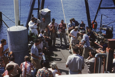 Members of the Capricorn Expedition (1952-1953) enjoying a party on the deck of the R/V Spencer F. Baird. Walter Heinrich ...