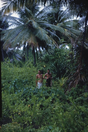 Winter Davis Horton and Edward Sheldon Barr shown here in the vegetation of Bikini Island, while on break from the Caprico...