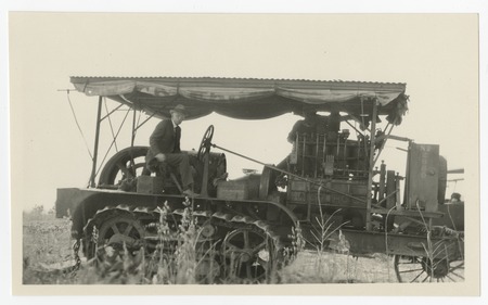 W. E. Hodges on a tractor on the day construction began at Santa Fe Park