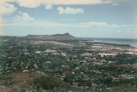 A panoramic view of Honolulu, Hawaii, and the Oahu coastline from a nearby hill top. This photo was taken by a member of t...