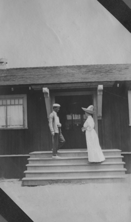 Man and woman on the steps of the Marine Biological Association of San Diego building at La Jolla Cove. The Association wo...