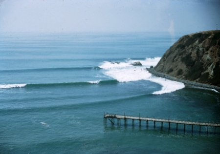 Southerly swell at Dana Point Cove, California. Waves are about 4-5&#39; high with pier in foreground. August 15, 1949.