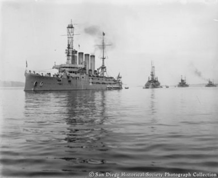 Battleships California, Oregon, South Dakota, and West Virginia in San Diego harbor with small craft alongside