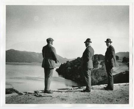 Unidentified men surveying Lake Henshaw Dam