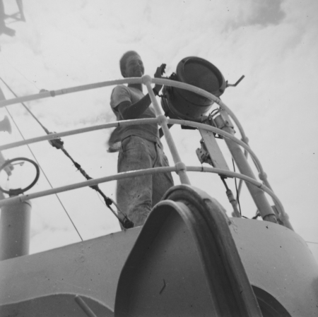 Edward S. Barr with signal light, R/V Horizon, MidPac Expedition