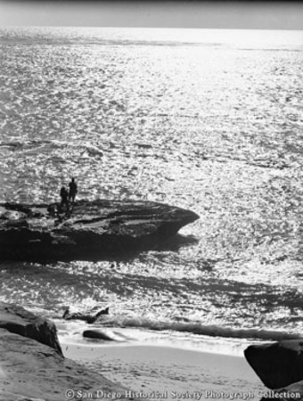 Men fishing from rock on La Jolla coastline