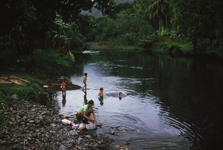 [Woman with children washing at River, Tahiti]