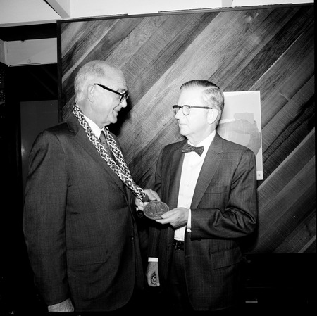 William D. McElroy (with medallion) and Charles J. Hitch (right), during inaugural celebration, UC San Diego