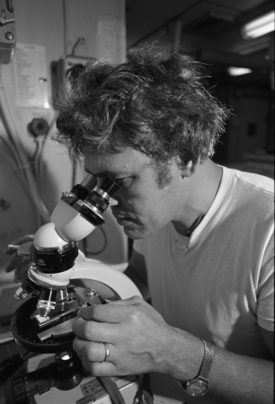 Deep Sea Drilling Project Leg 34, Manuel N. Bass with microscope. 1973