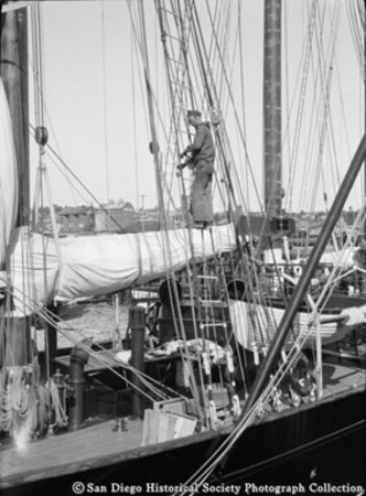 Sailor on rigging of ship