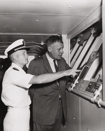 Roger Revelle, Naval Research Advisory Committee, and Officer Willis on flight deck U.S.S. Enterprise (CVA(N)-65)