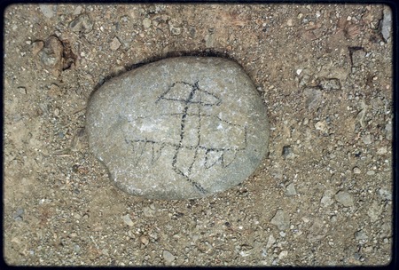 Kairiru: child&#39;s drawing of an airplane, made on a stone