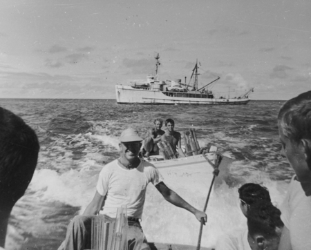 September 24, Bringing supplies ashore to set up camp &quot;Little Petunia&quot;, Bikini Atoll. Left to right (foreground) Russell R...