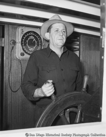 Captain at wheel of tuna boat Benita