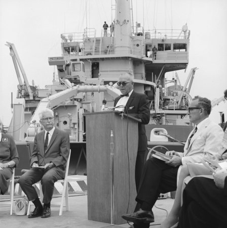 Captain Noel L. Ferris, with William A. Nierenberg (right) and Marston Cleaves Sargent (left), speaking at the dedication ...