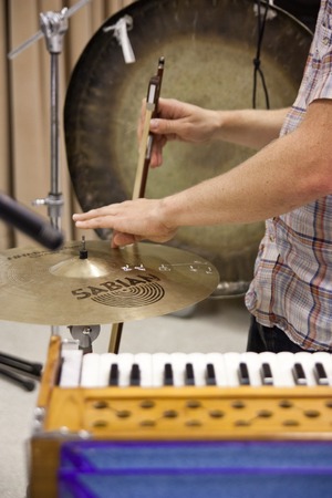 Ping: Rehearsal for 2011 UC San Diego performance: Ross Karre bowing cymbal