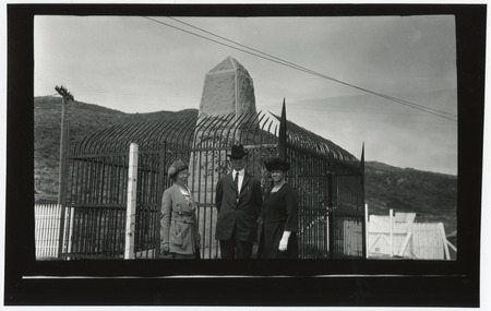 Three people near U.S.-Mexico border monument
