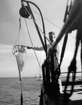 Roger Revelle with plankton net on the Scripps Pier