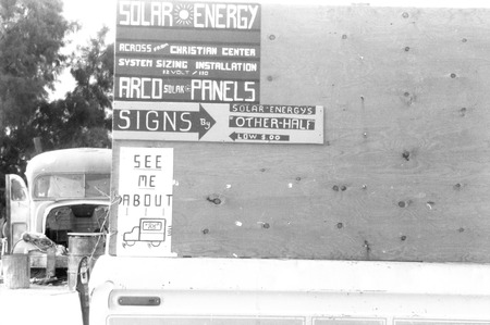 Slab City: photograph of signs advertising solar panel sales booth