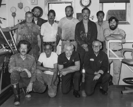 Shipboard marine crew, including Joseph Clarke (second from left, kneeling) the captain of the D/V Glomar Challenger (ship...