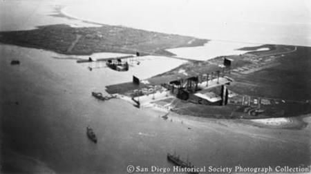 Aerial view of biplanes flying over San Diego Bay and North Island