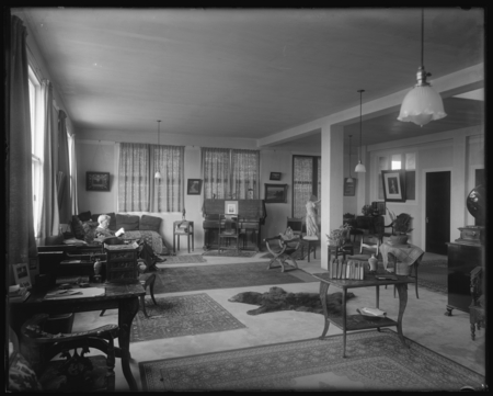 William Emerson Ritter sitting and reading in his apartment, which was the (top) second floor of the George H. Scripps Mem...