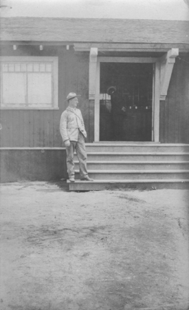 Man on the steps of the Marine Biological Association of San Diego building at La Jolla Cove. The Association became the S...