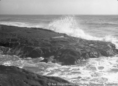 Ocean waves crashing against rocks