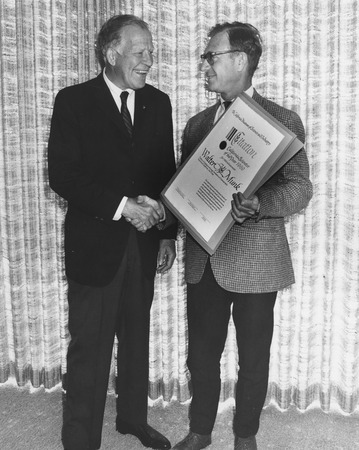 Walter Heinrich Munk (right) receiving California Scientist of the Year award from Donald P. Loker