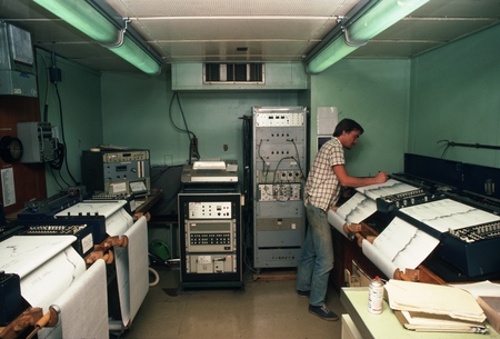 [Man in D/V Glomar Challenger laboratory with bottom profile echosounder chart printers]