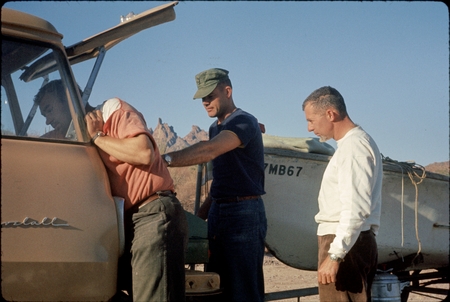 Three unidentified men during field work