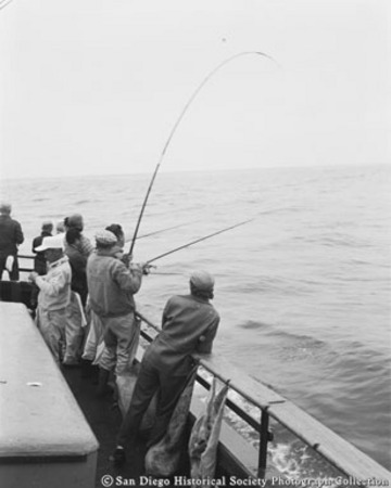 Men fishing from side of Sportfisher IV off Coronado Islands