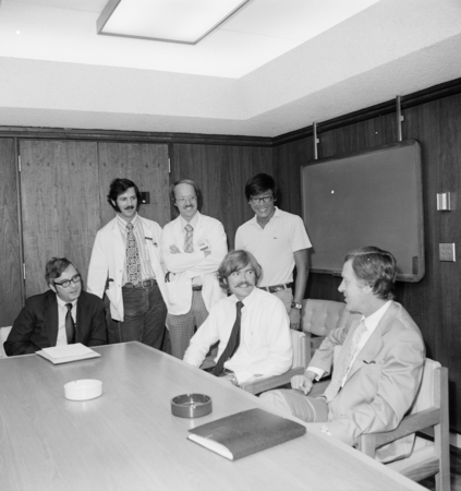 Robert N. Hamberger (right) talking with medical students