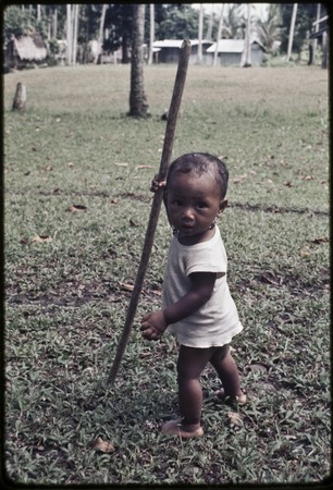 Infant walking with stick