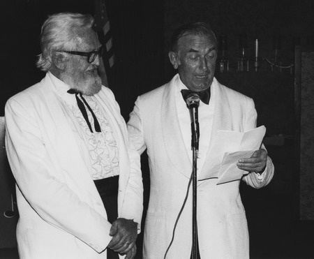 John Dove Isaacs (left) receiving an award