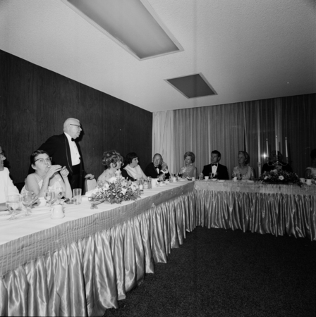 Chancellor William J. McGill standing at the head table during the UC San Diego Faculty Ball