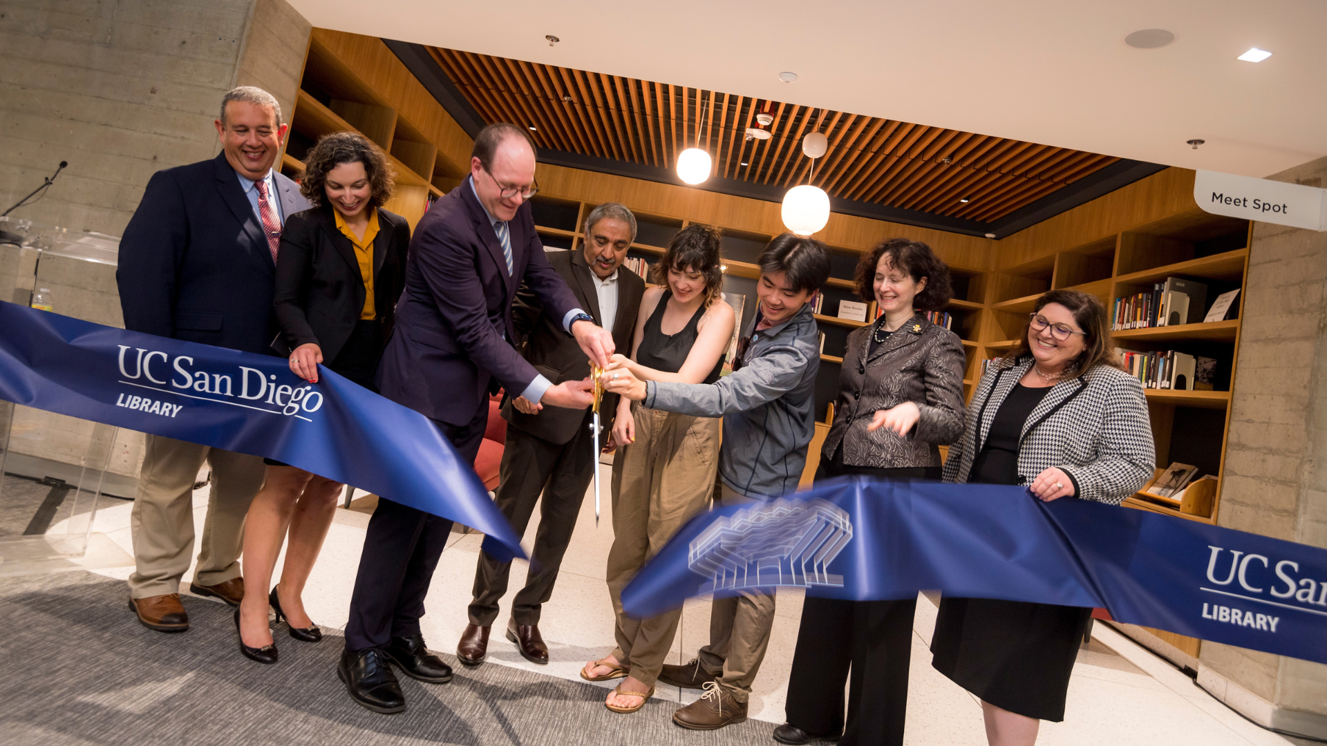A photo of UC San Diego's leadership cutting the ribbon at the Geisel Library Renovation Reveal.
