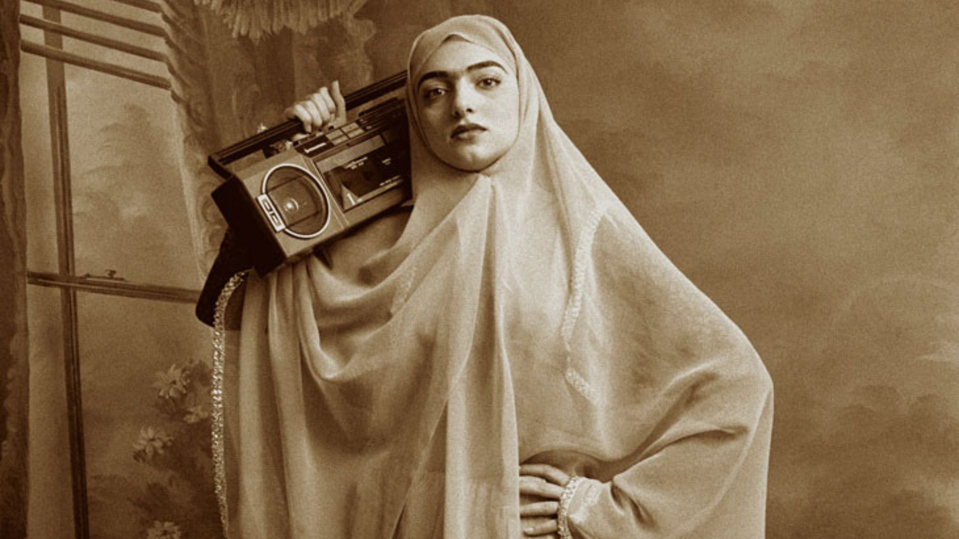 Image of an Iranian woman holding a boom box stereo