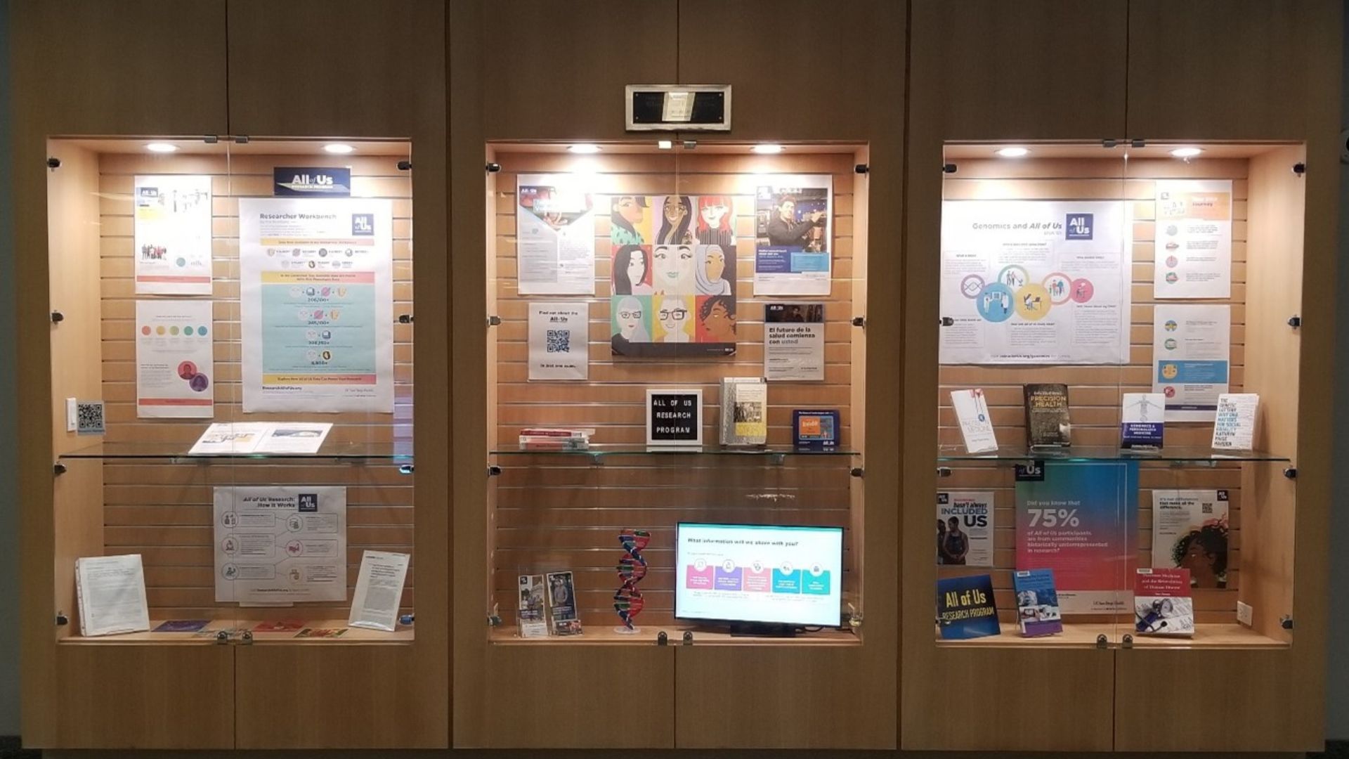 Photo of display cases showcasing All of Us Research Program information.