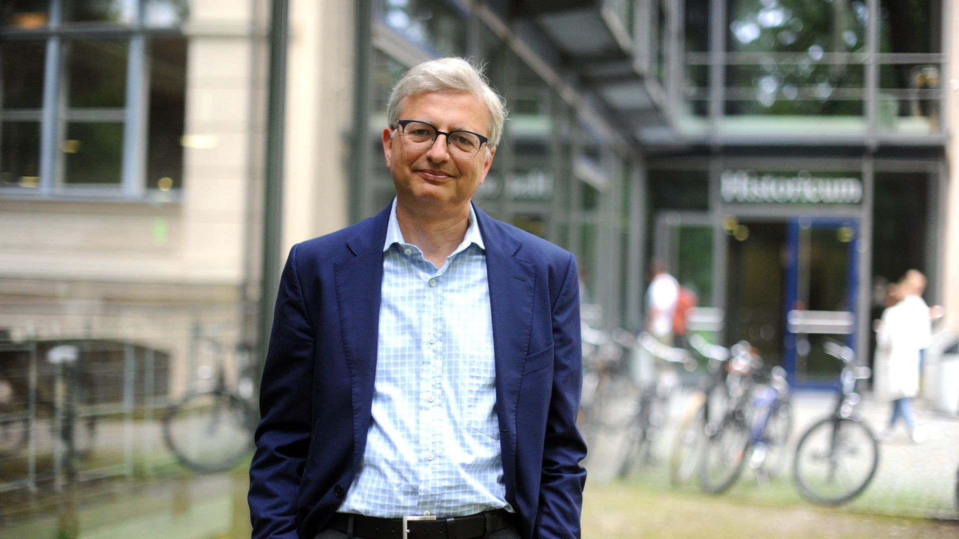 Professional headshot of Michael Brenner standing in front of a building.